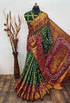 Dark green and red color hand bandhej silk saree with zari weaving work