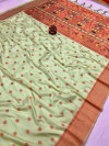 Pista green color paithani silk saree with copper zari weaving work