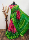 Pink and green color hand bandhej silk saree with zari weaving work
