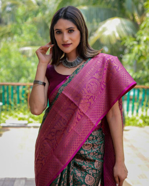 Dark green color kanchipuram silk saree with zari woven work