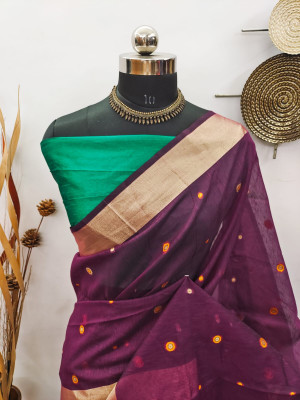 Magenta color raw silk saree with zari woven work