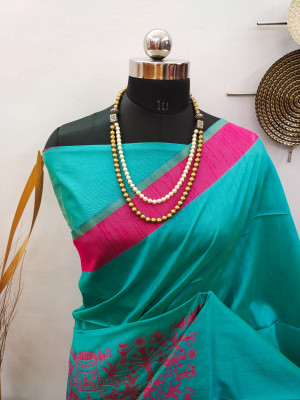 Rama green color raw silk saree with woven work