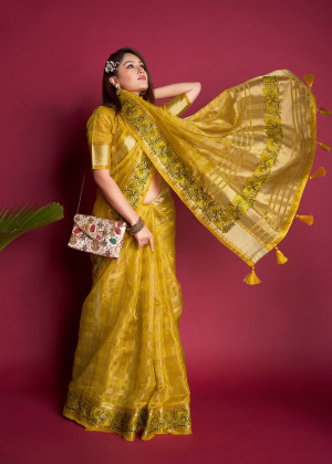 Yellow color organza silk saree with embroidered and zari weaving work