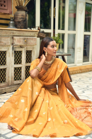 Mustard yellow color linen silk saree with zari weaving work