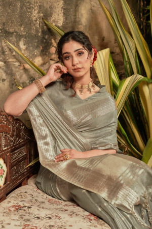 Mehndi green color linen silk saree with zari woven work