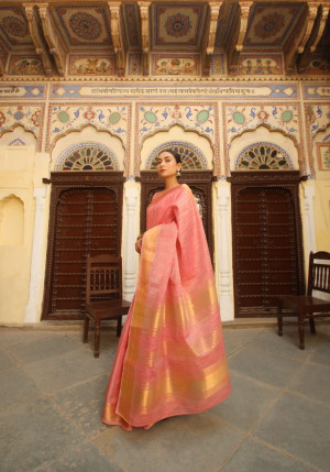 Peach color tussar silk saree with zari woven border