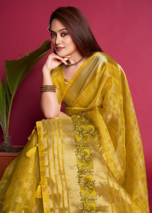 Yellow color organza silk saree with embroidered and zari weaving work