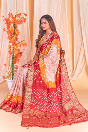 Beige color bandhej silk saree with zari weaving work