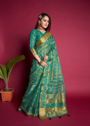 Green color organza silk saree with embroidered and zari weaving work