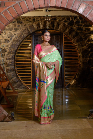 Pista green color paithani silk saree with zari weaving work