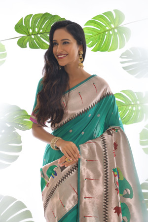 Rama green color paithani silk saree with zari weaving work