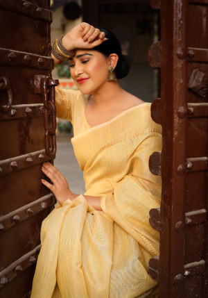 yellow color tussar silk saree with zari woven border