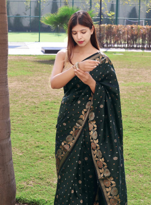 Dark green color soft banarasi silk saree with zari weaving work