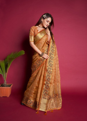 Peach color organza silk saree with embroidered and zari weaving work