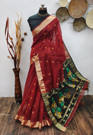 Maroon color raw silk saree with zari woven work