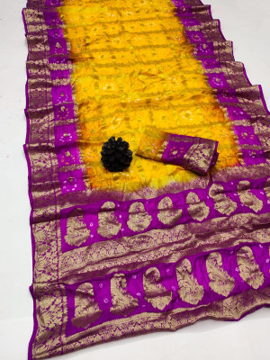 Yellow and rani pink color hand bandhej silk saree with zari weaving work