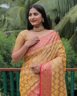 Yellow color linen silk saree with zari weaving work