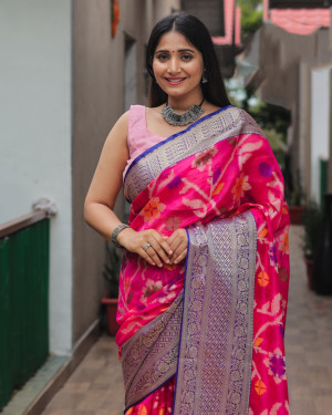 Rani pink color organza silk saree with woven design