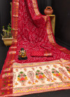 Red color hand bandhej silk saree with meenakari weaving work