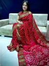 Red color bandhani saree with hand bandhej work
