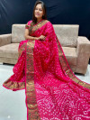 Pink color bandhani saree with hand bandhej work