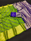 Parrot green color hand bandhej silk saree with zari weaving work