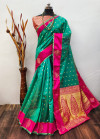 Sea green color soft organza silk saree with zari weaving work