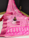 Pink color soft dola silk saree with laheriya printed work