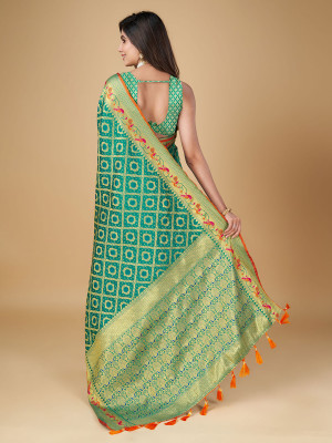 Rama green color patola silk saree with woven design