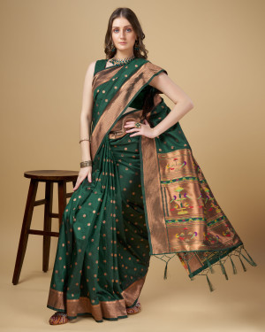Dark green color paithani silk saree with copper zari weaving work