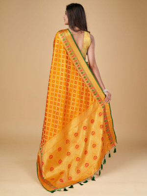 Mustard yellow color patola silk saree with zari weaving work