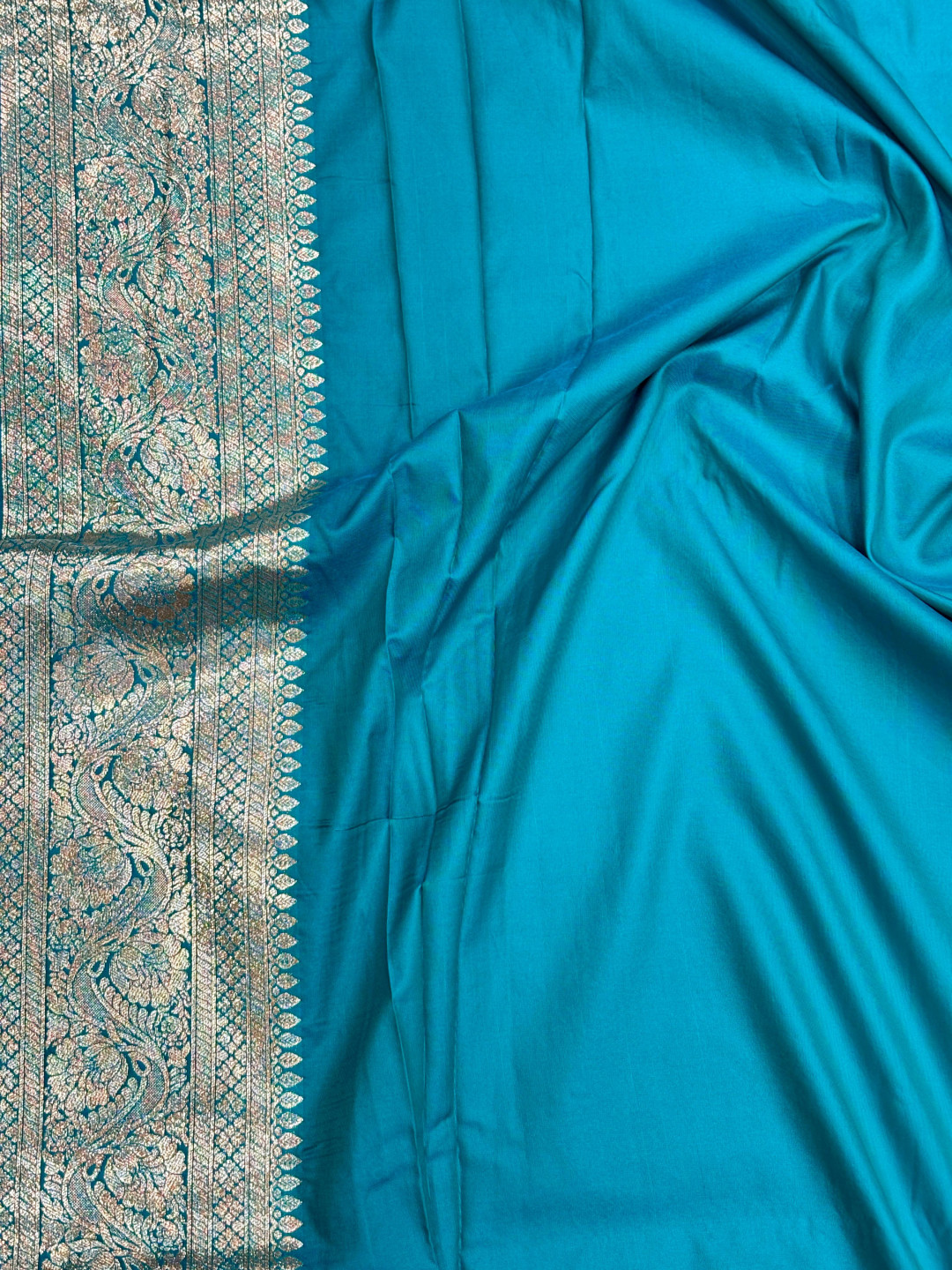 Rama green color banarasi silk saree with zari weaving work